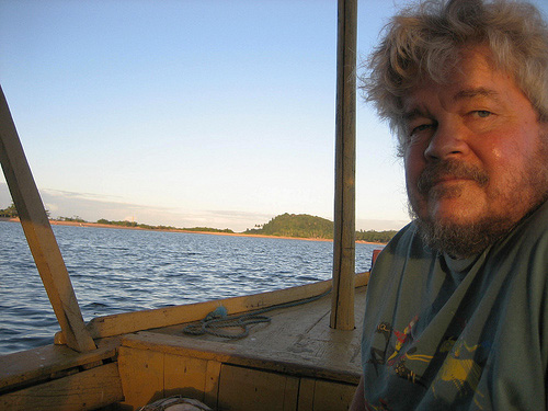 bob stilger at the helm of a boat
